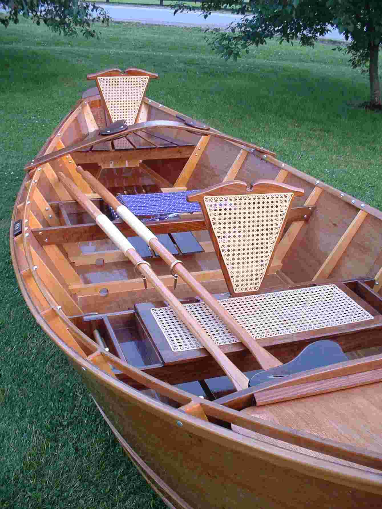 thai craftsman building a traditional wooden boat